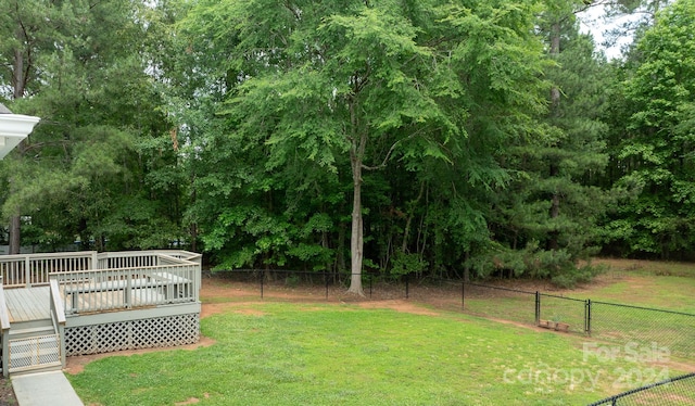 view of yard with a wooden deck