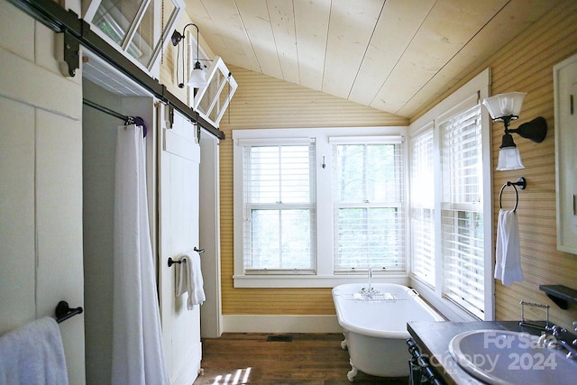 bathroom with wooden walls, a tub, lofted ceiling, and wood ceiling