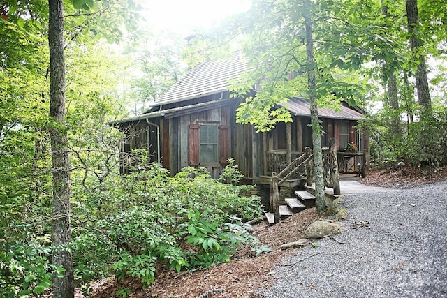 view of outdoor structure with a sunroom