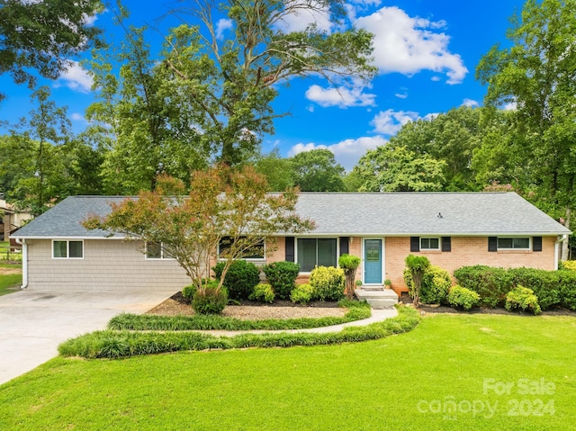 ranch-style home with a front lawn