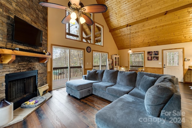 living room with ceiling fan, a stone fireplace, dark hardwood / wood-style flooring, high vaulted ceiling, and wood ceiling