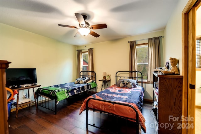 bedroom featuring dark hardwood / wood-style floors and ceiling fan