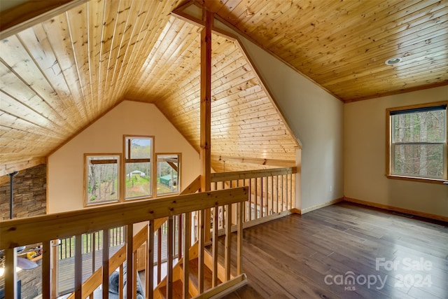 additional living space with wood-type flooring, vaulted ceiling, and wooden ceiling