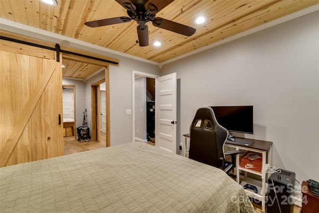 bedroom featuring ornamental molding, wood ceiling, ceiling fan, a barn door, and light hardwood / wood-style floors