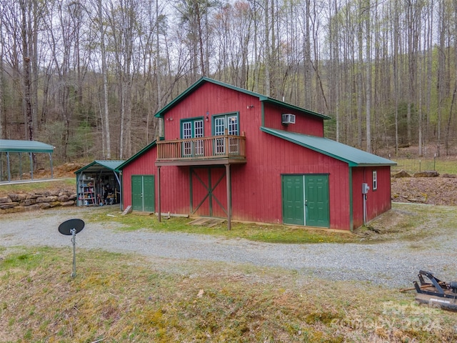 view of outbuilding with a carport