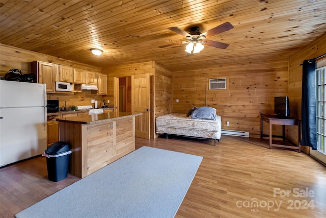 bedroom with a baseboard heating unit, a wall mounted AC, white fridge, wood ceiling, and light wood-type flooring