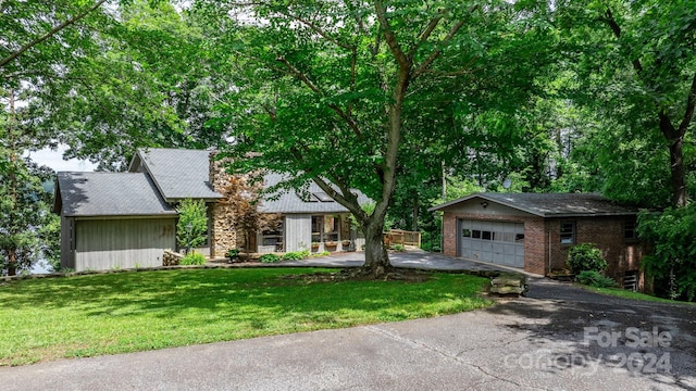 ranch-style home featuring a front yard and a garage