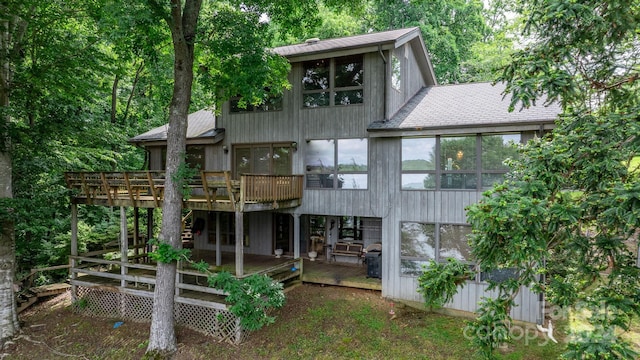 rear view of house featuring a deck