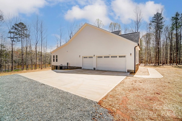 view of side of home with a garage