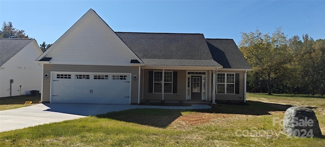 view of front facade featuring a front lawn and a garage