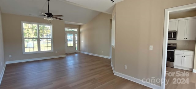 interior space featuring lofted ceiling, hardwood / wood-style floors, and ceiling fan