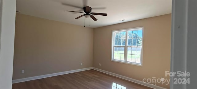 empty room featuring wood-type flooring and ceiling fan