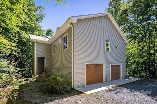 view of property exterior with a garage