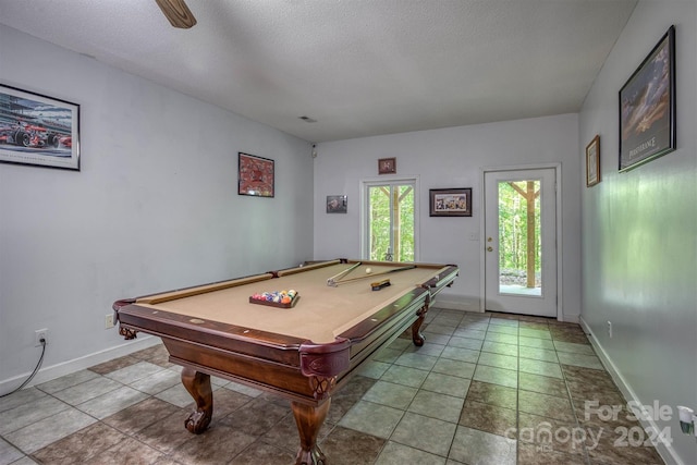 playroom featuring ceiling fan, a textured ceiling, and billiards