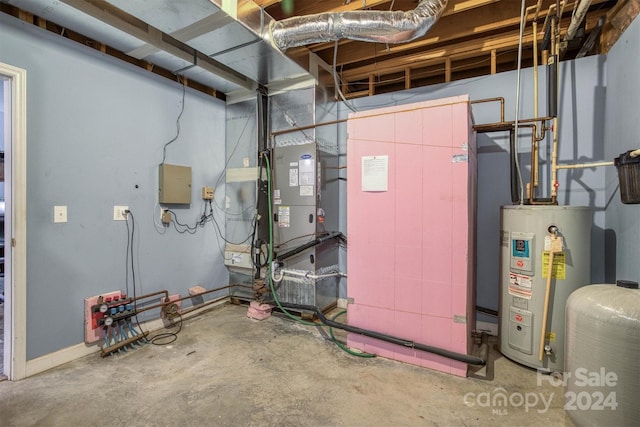 utility room featuring heating unit and water heater