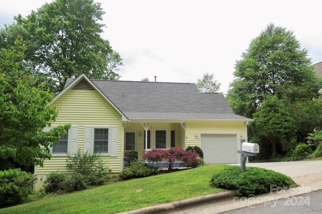 single story home featuring a front yard and a garage