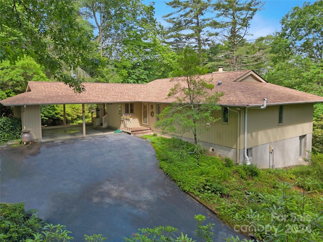 ranch-style house with a carport