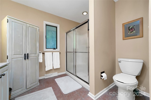 bathroom with toilet, tile patterned flooring, and walk in shower