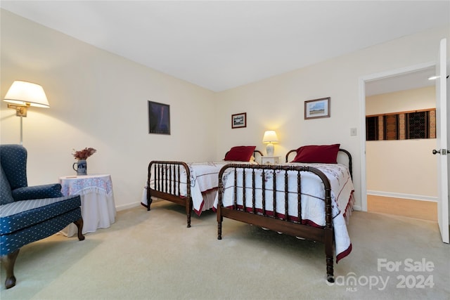 bedroom with light carpet