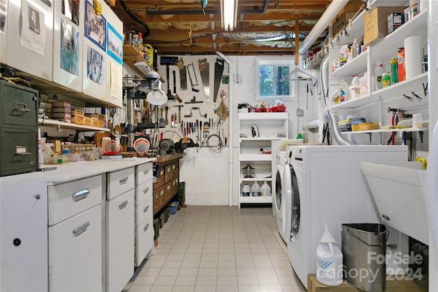 clothes washing area featuring sink