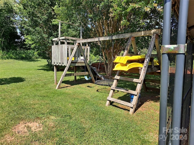 view of jungle gym with a lawn