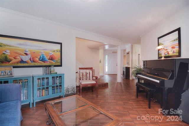 sitting room featuring crown molding