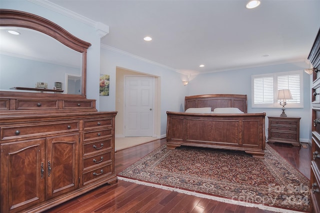 bedroom featuring dark hardwood / wood-style floors and ornamental molding