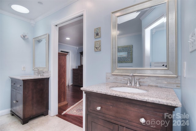 bathroom featuring decorative backsplash, vanity, crown molding, and tile patterned flooring