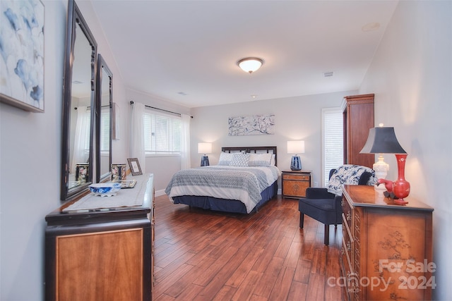 bedroom featuring dark wood-type flooring