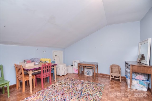 game room featuring parquet floors and vaulted ceiling