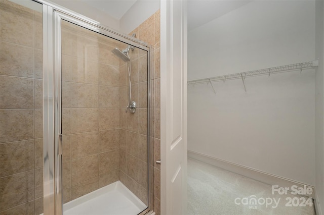 bathroom with a shower with shower door