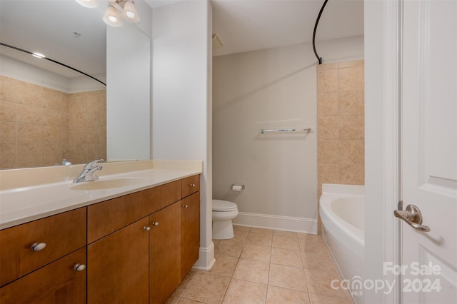 bathroom with tile patterned floors, vanity, and toilet