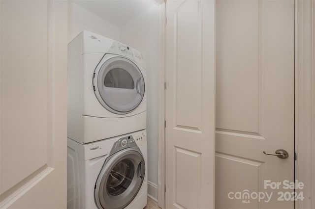 laundry room featuring stacked washer and dryer