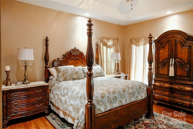 bedroom with hardwood / wood-style flooring