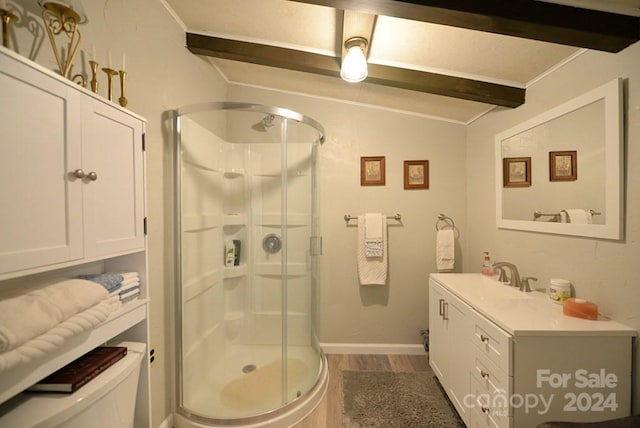 bathroom featuring hardwood / wood-style floors, vanity, vaulted ceiling with beams, toilet, and walk in shower