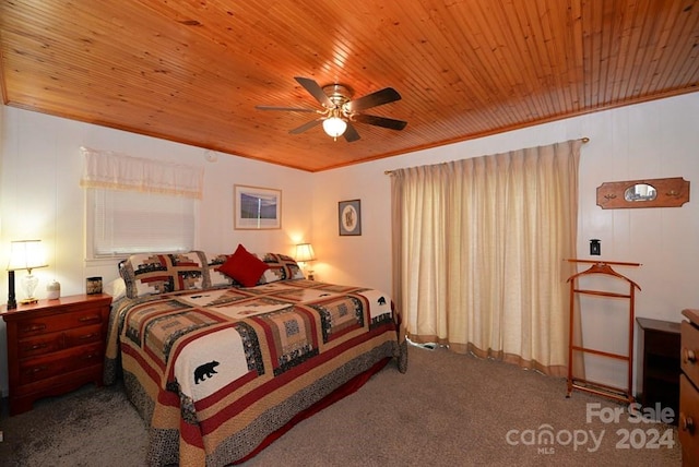 bedroom with ceiling fan, crown molding, carpet floors, and wooden ceiling