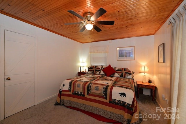 carpeted bedroom with ceiling fan, crown molding, and wood ceiling