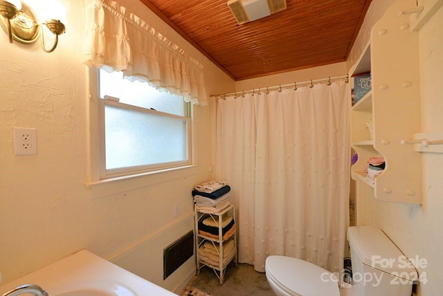 bathroom featuring wooden ceiling, toilet, and sink