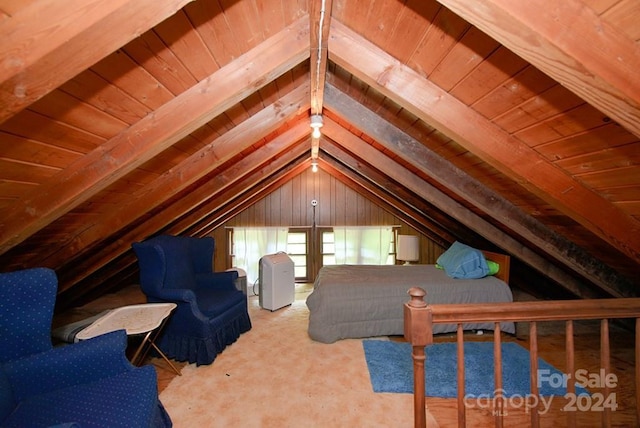 bedroom with lofted ceiling with beams