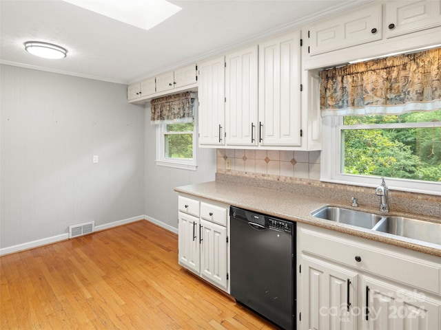 kitchen featuring crown molding, dishwasher, sink, white cabinets, and light hardwood / wood-style floors