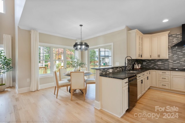 kitchen featuring cream cabinets, sink, decorative backsplash, black dishwasher, and decorative light fixtures