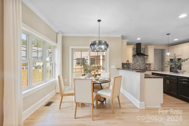 4023 Randolph Rd, Charlotte, NC 28211 - dining room featuring light wood finished floors, recessed lighting, baseboards, ornamental molding, and a chandelier