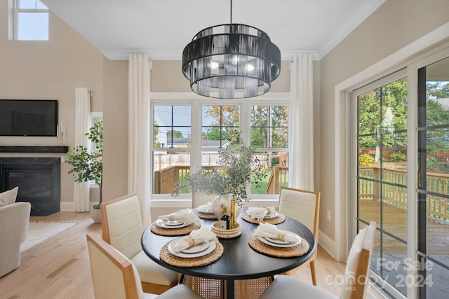 4023 Randolph Rd, Charlotte, NC 28211 - dining room featuring light wood-style floors, ornamental molding, a chandelier, and baseboards