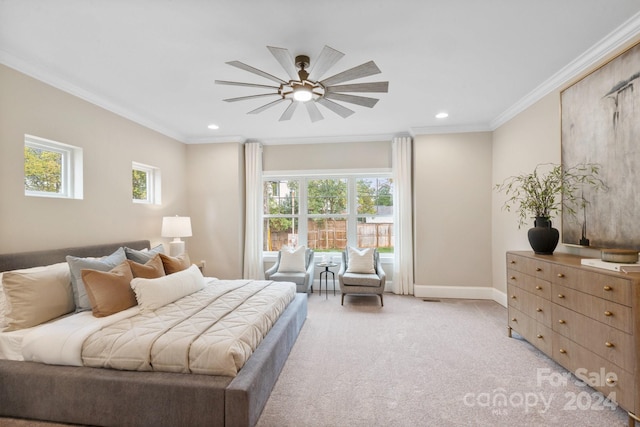 carpeted bedroom featuring multiple windows, ceiling fan, and ornamental molding