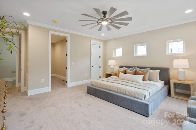 bedroom featuring multiple windows, ceiling fan, light carpet, and ornamental molding