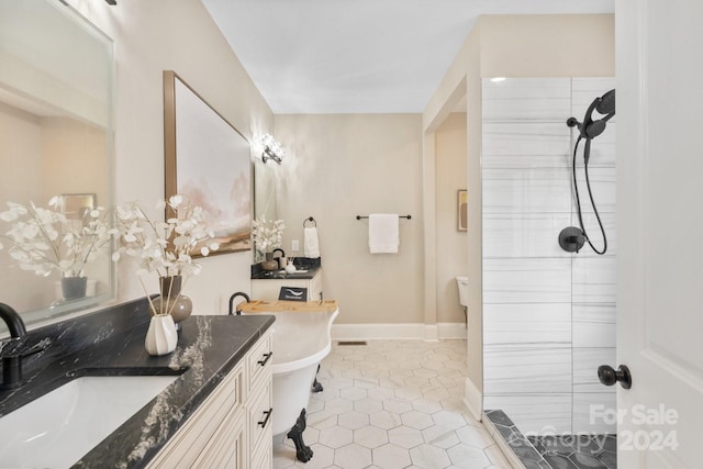 bathroom with separate shower and tub, tile patterned flooring, and vanity