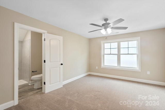 4023 Randolph Rd, Charlotte, NC 28211 - unfurnished bedroom featuring carpet floors, baseboards, ensuite bathroom, and a ceiling fan