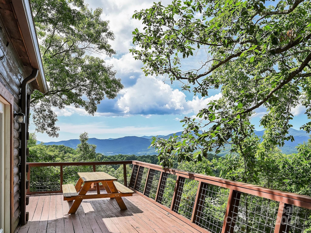 wooden deck with a mountain view