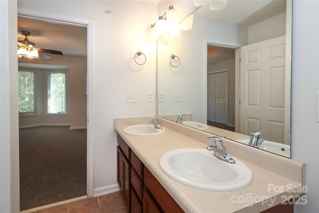 bathroom featuring a sink and double vanity