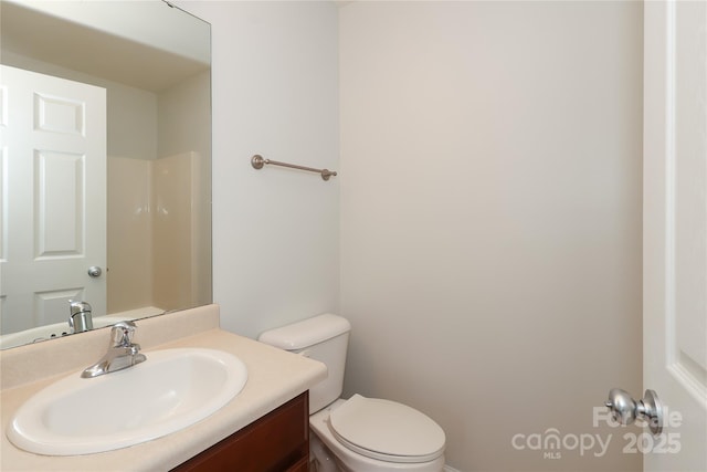 bathroom featuring vanity and toilet
